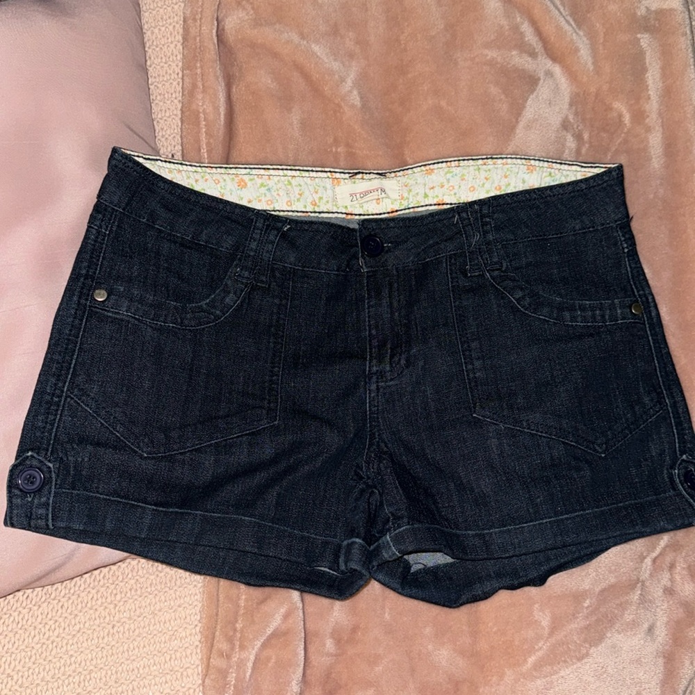Forever 21 women’s jean shorts in size 30 and color is a dark denim.